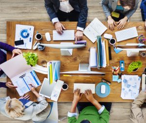 Top down view of a conference table with a business meeting in progress