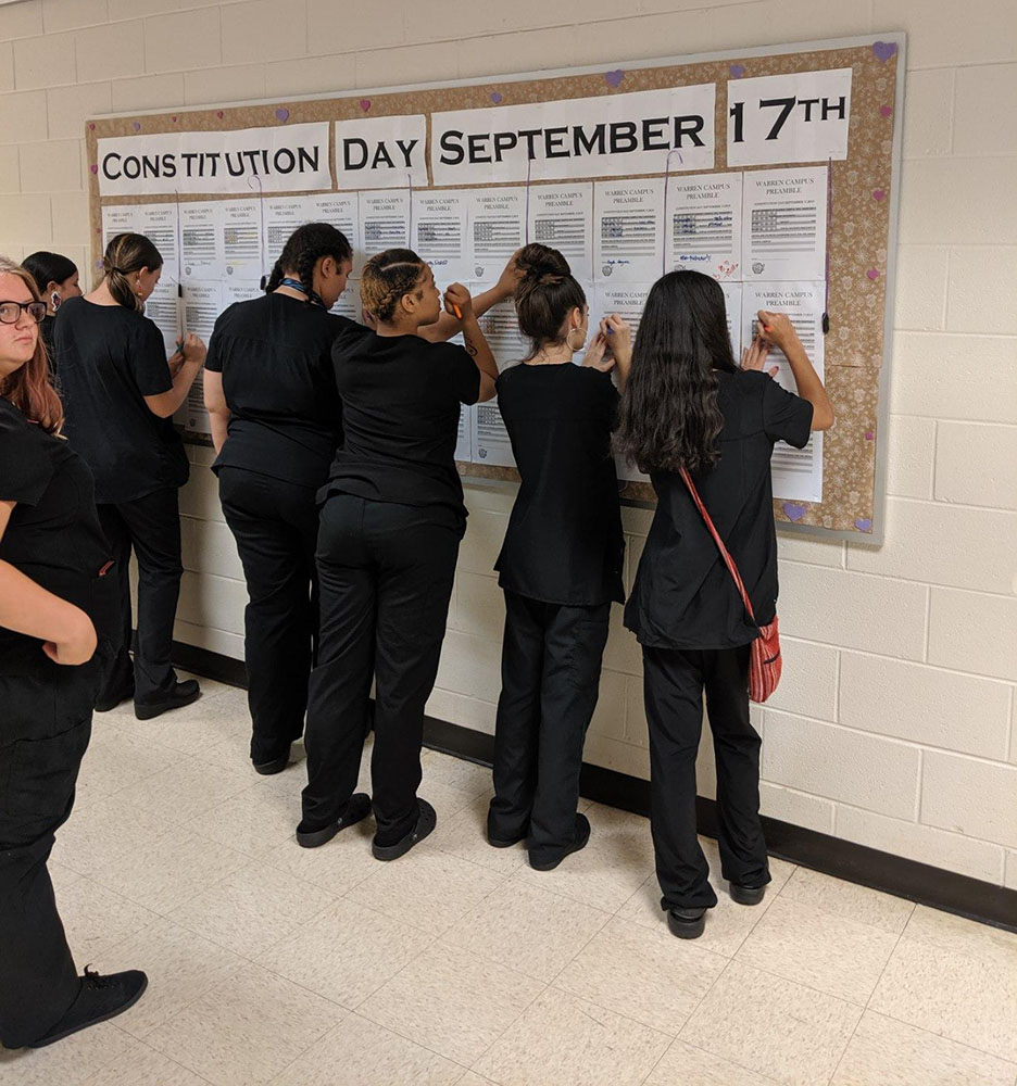 South Campus Students interacting with a game board for Constitution Day